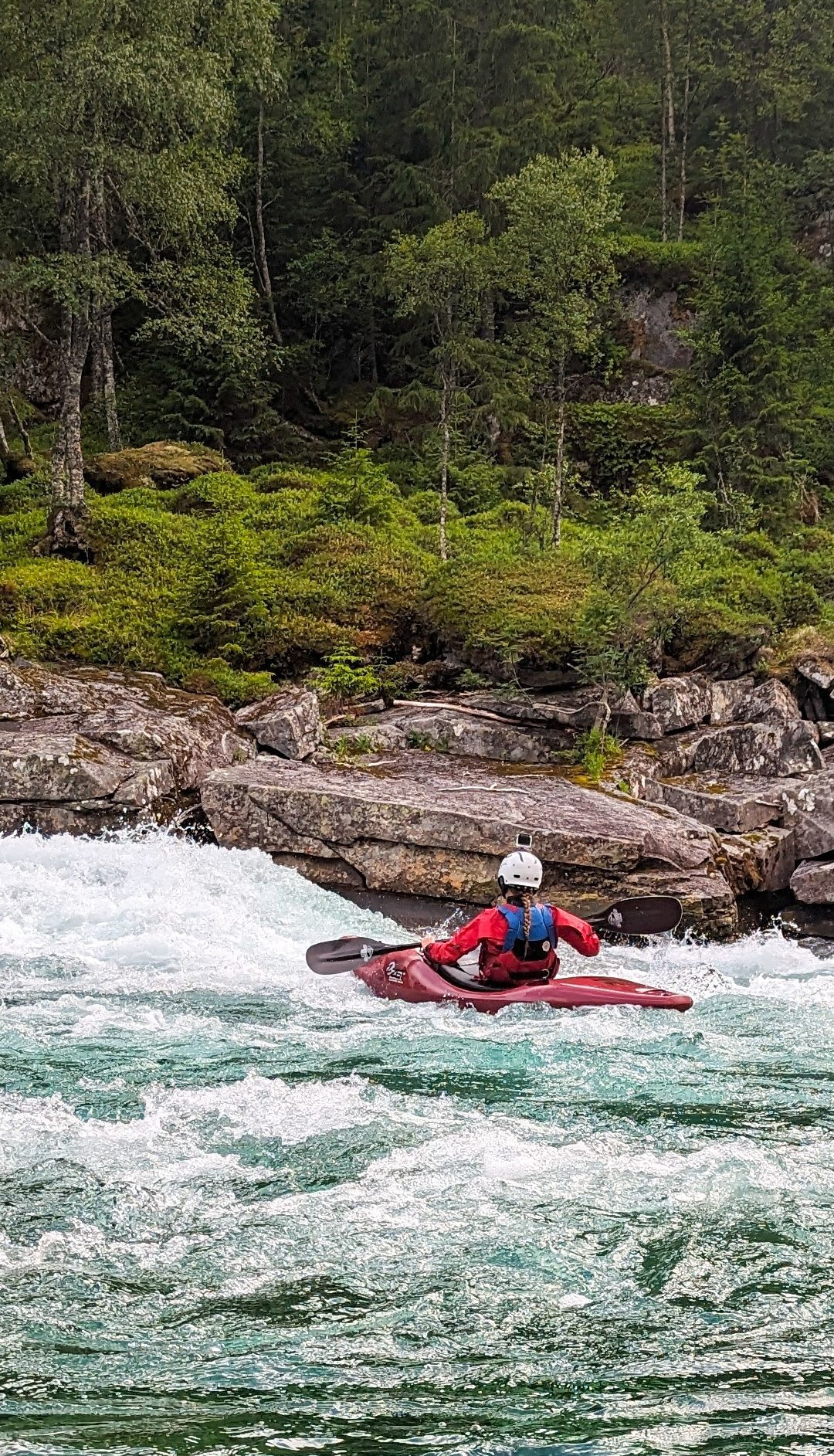 Paddling Raundalselva river in Norway.